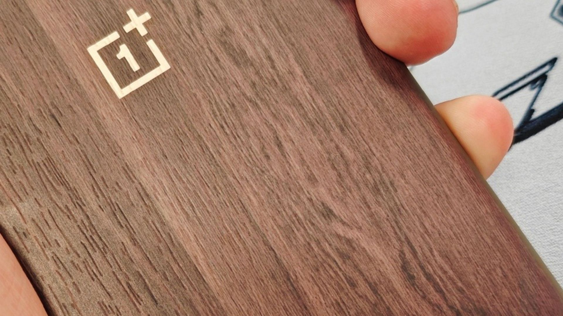 The OnePlus 12 may sport a wood texture back, or at the very least a wood texture casing.